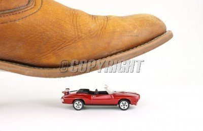 royalty-free-photos-a-small-toy-convertible-car-about-to-be-crushed-by-a-man-s-boot-pixmac-72426.jpg